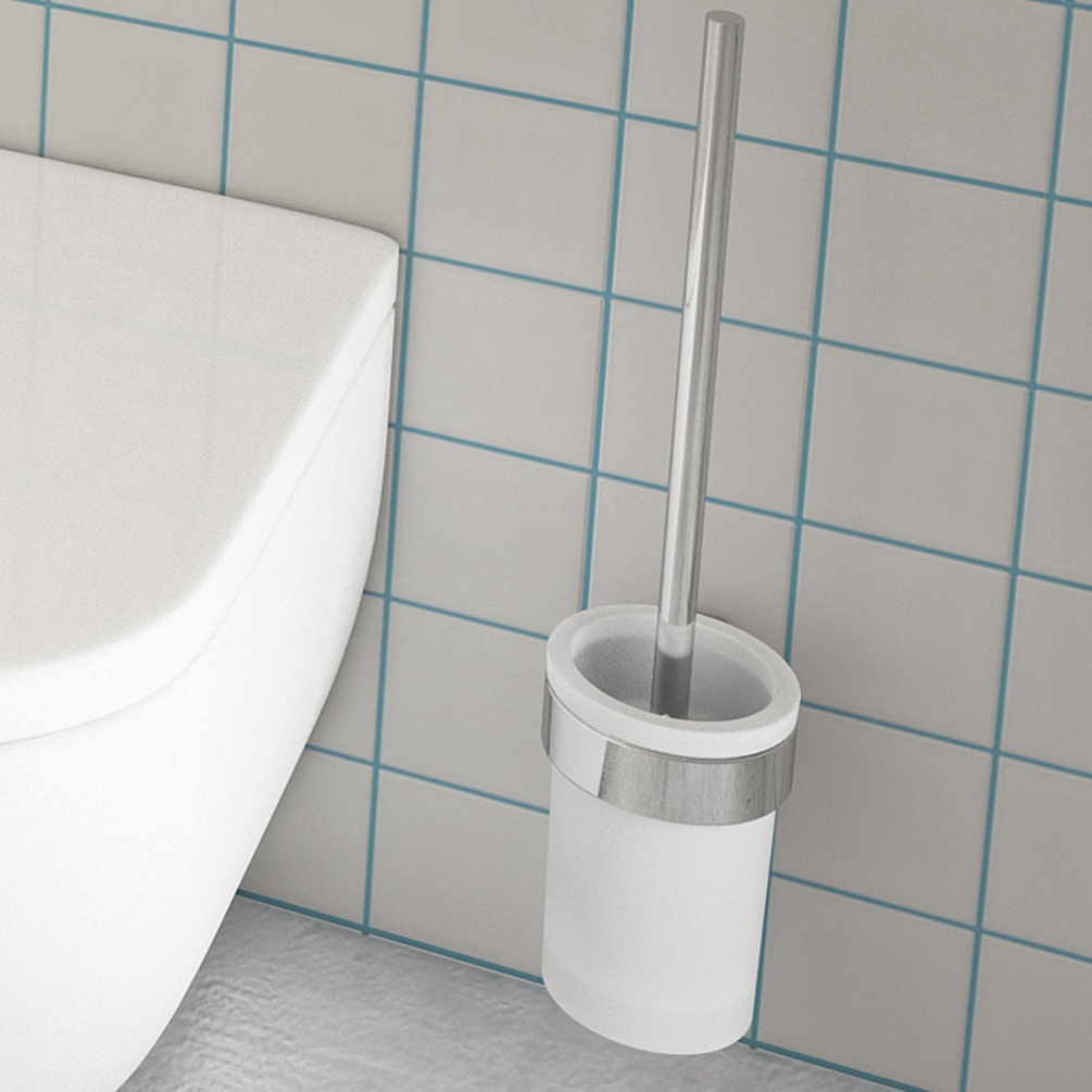 close up lifestyle image of origins living pirenei chrome toilet brush set on white tiled wall